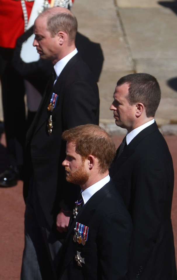 The brothers stood apart as they followed Philip's coffin into the chapel