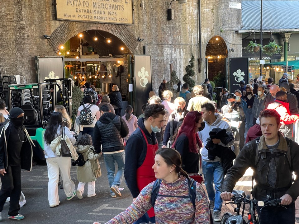 Crowds of people enjoying their afternoon in London