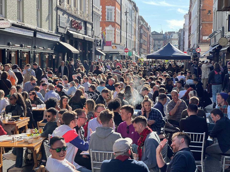 Soho was packed with happy sun-seeking Brits having a drink