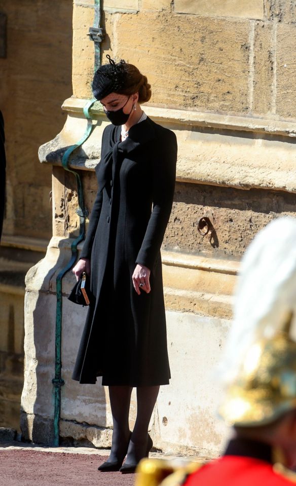 The Duchess of Cambridge bows her head