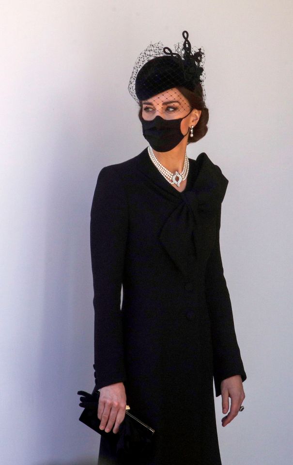 Kate Middleton wore a pearl necklace and black face mask