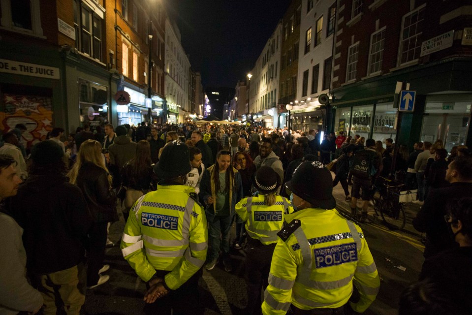 Cops were in Soho as revellers enjoy the first Saturday with open pubs