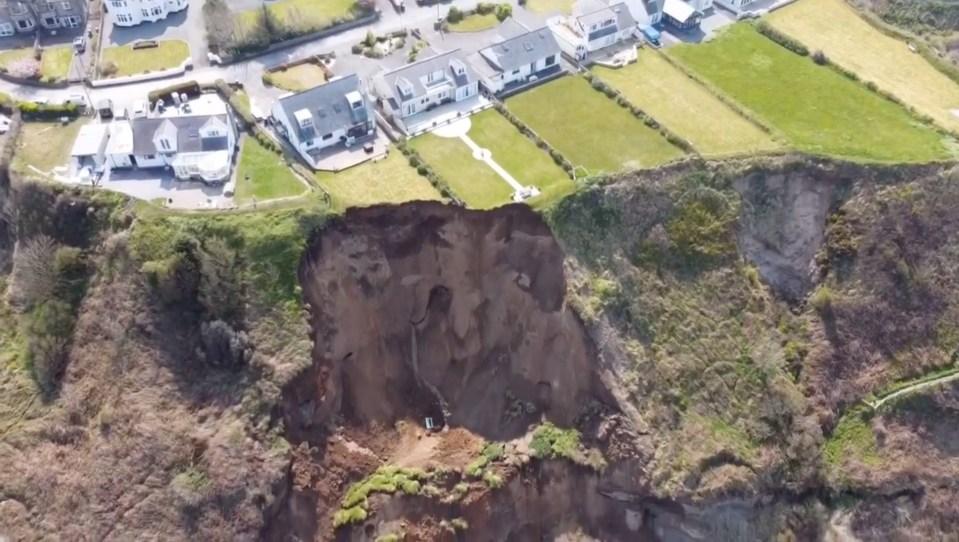 Large parts of clifftop gardens - and even a wooden bench - were carried onto the beach as huge rocks fell at Nefyn near Pwllheli