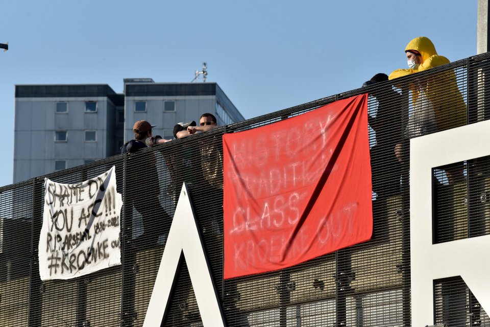 Arsenal fans put banners up outside the Emirates