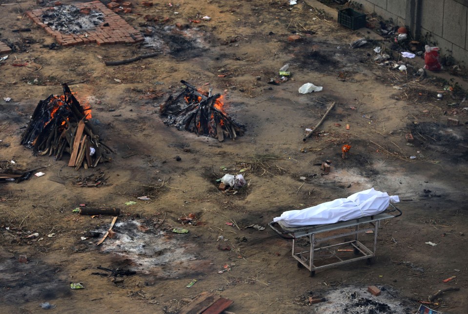 Multiple funeral pyres of patients who died of Covid burning