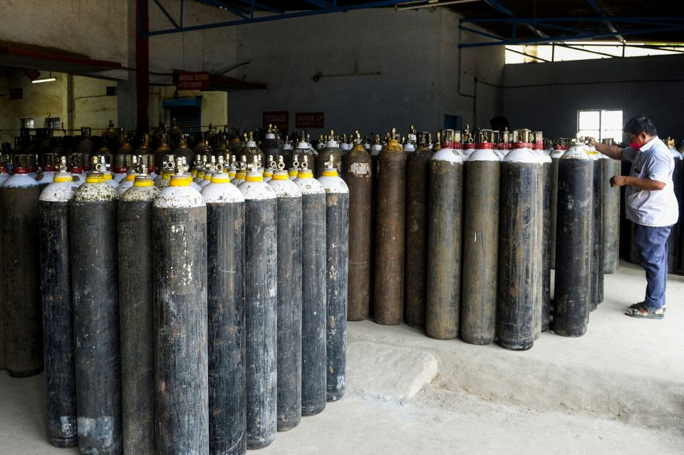 Medical oxygen cylinders wait to be transported to hospitals