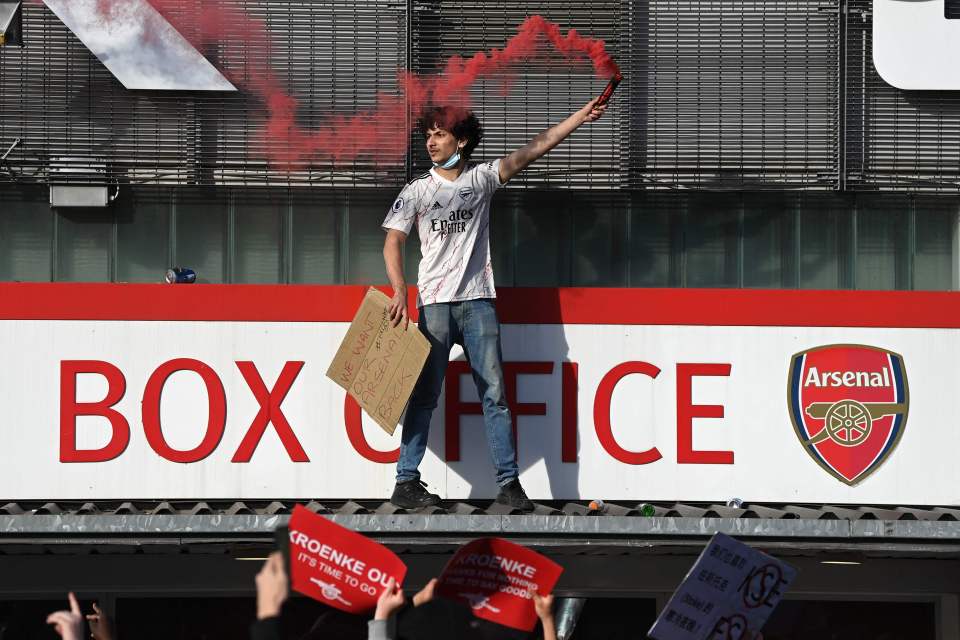 A fan scaled the ticket office roof with a flare