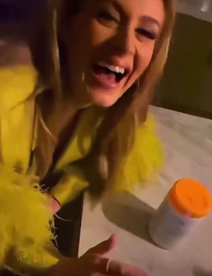 The singer danced in a £1,760 lime green coat and drank Moscow mule cocktails