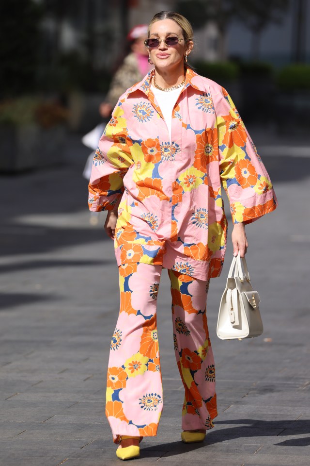 Ashley Roberts sported a Seventies-style flower power shirt and matching flared trousers