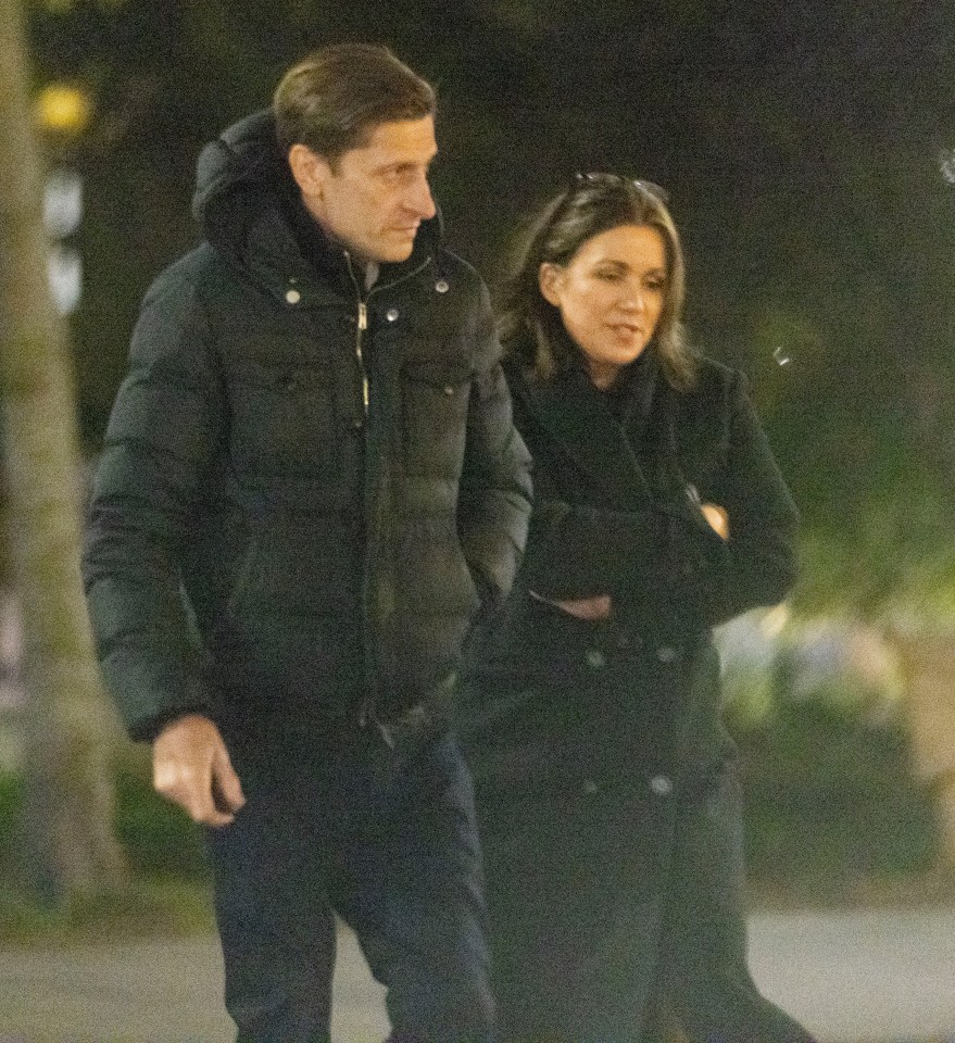 Both wrapped up in black coats for the date