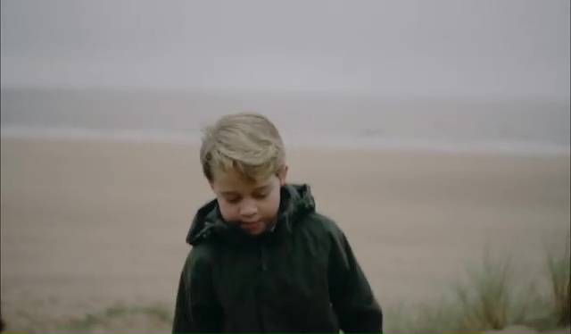 George, who would have been seven, playing with his parents on a Norfolk beach