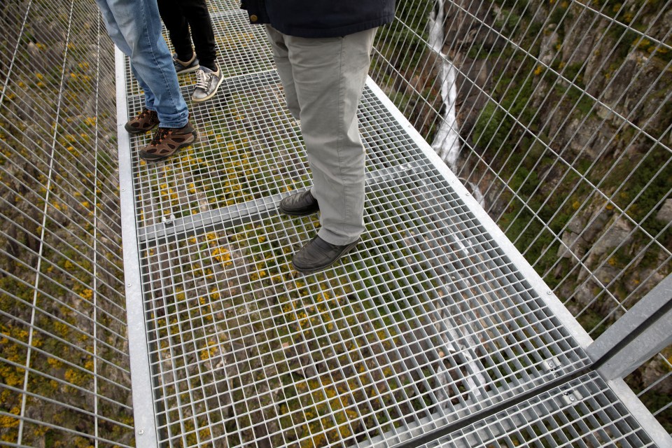 Brave tourists can look directly below the metal grate bottom