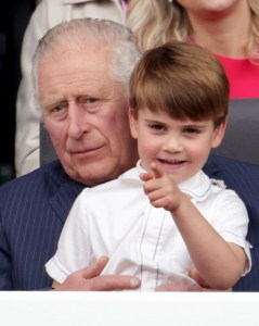  Prince Louis sits on the Prince of Wales lap during the Platinum Jubilee Pageant (PA)