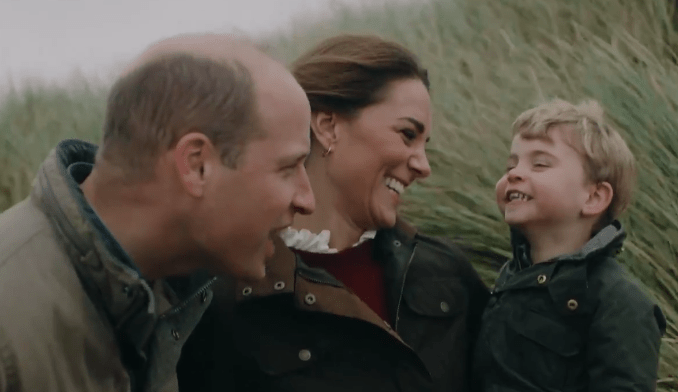 They were filmed playing with their young children on a Norfolk beach