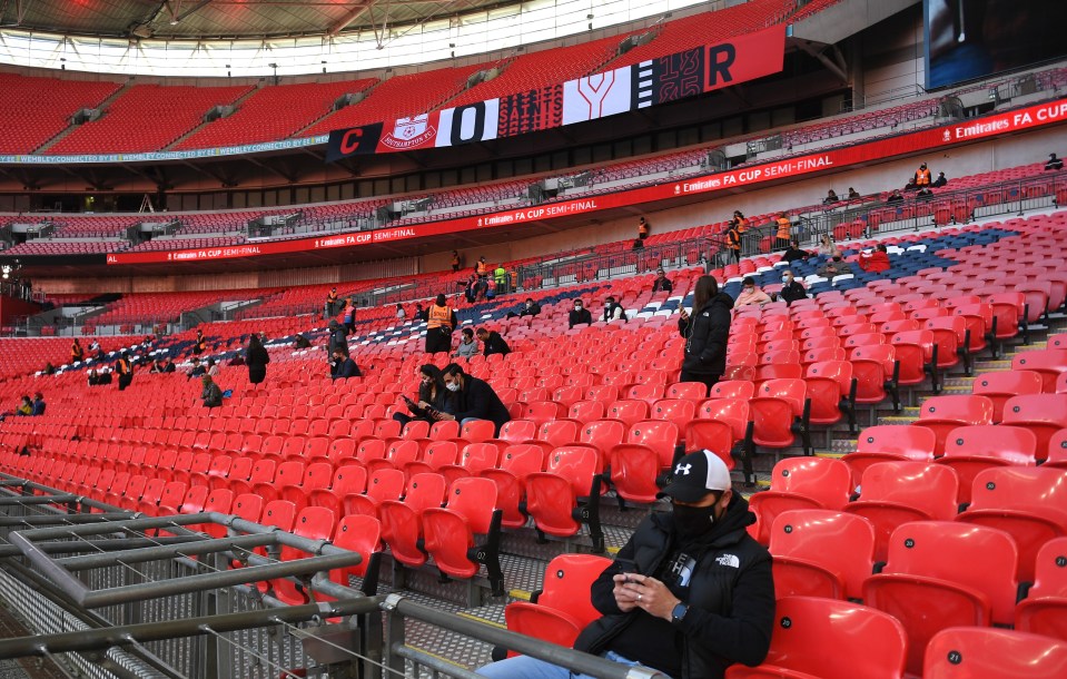 Fans take their place in the Wembley seats - with plenty of space