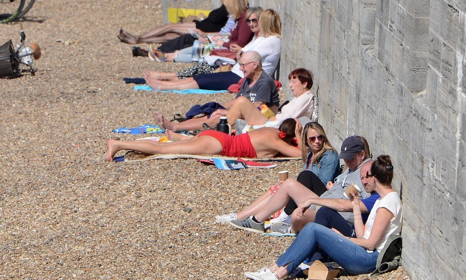 Sun seekers at the Hot Walls in Old Portsmouth