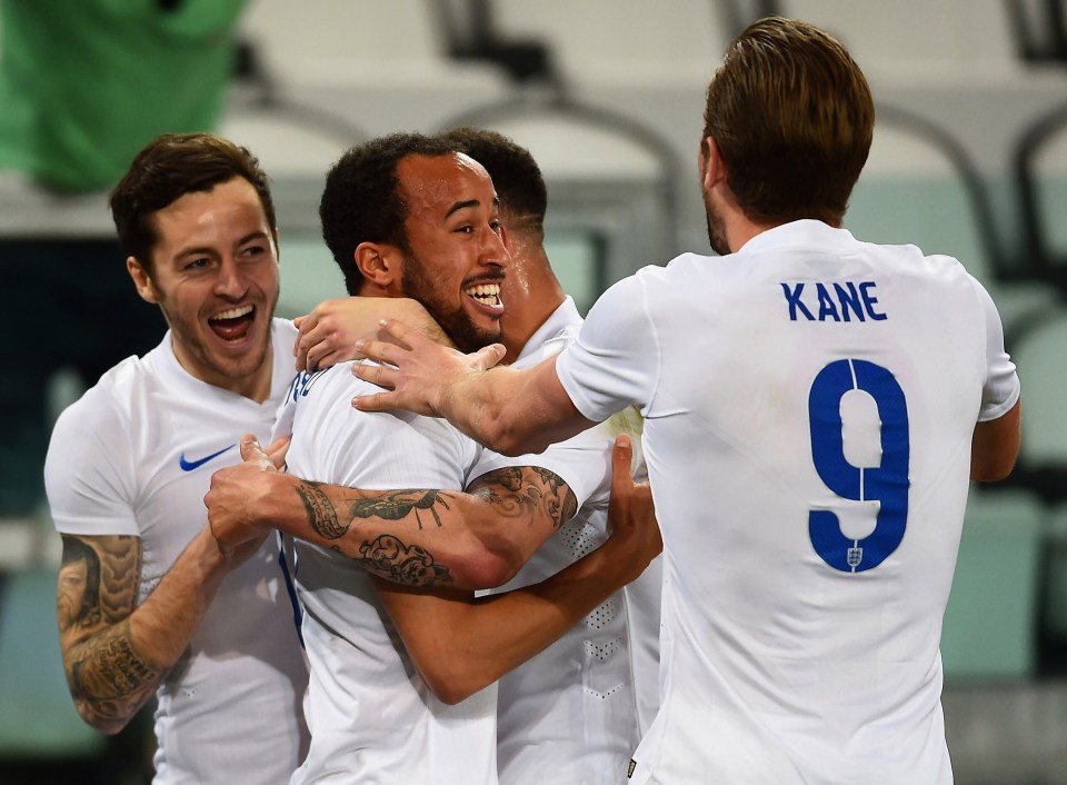 Andros Townsend celebrates scoring against Italy after being assisted by Mason