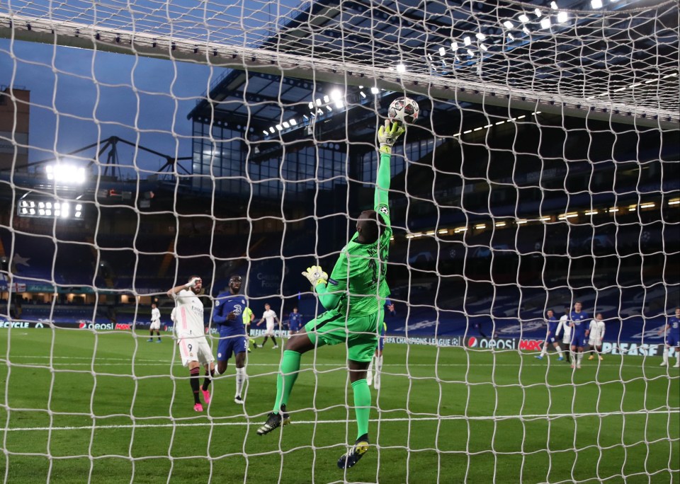 Edouard Mendy tips over this effort from Real hitman Karim Benzema