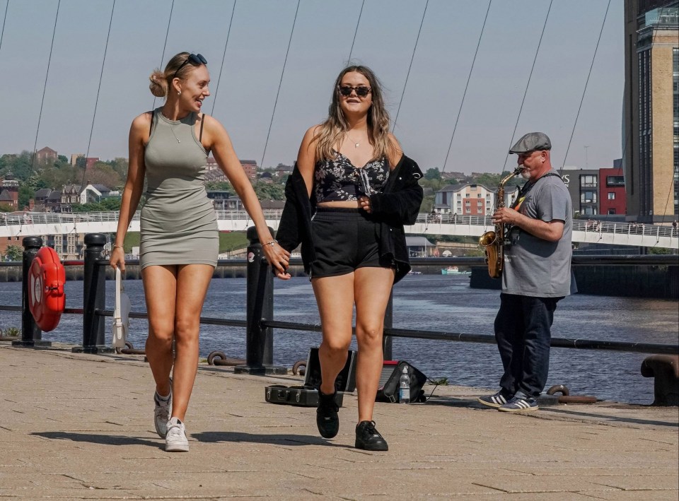 Two women take a stroll through Newcastle's Quayside