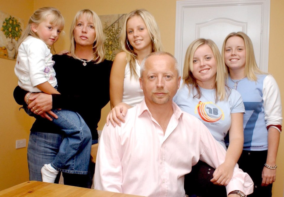 Giles with his family in 2004 (l-r) - daughter Katie, ex-wife Deborah, daughter Lucy and twins Sophie and Natatile