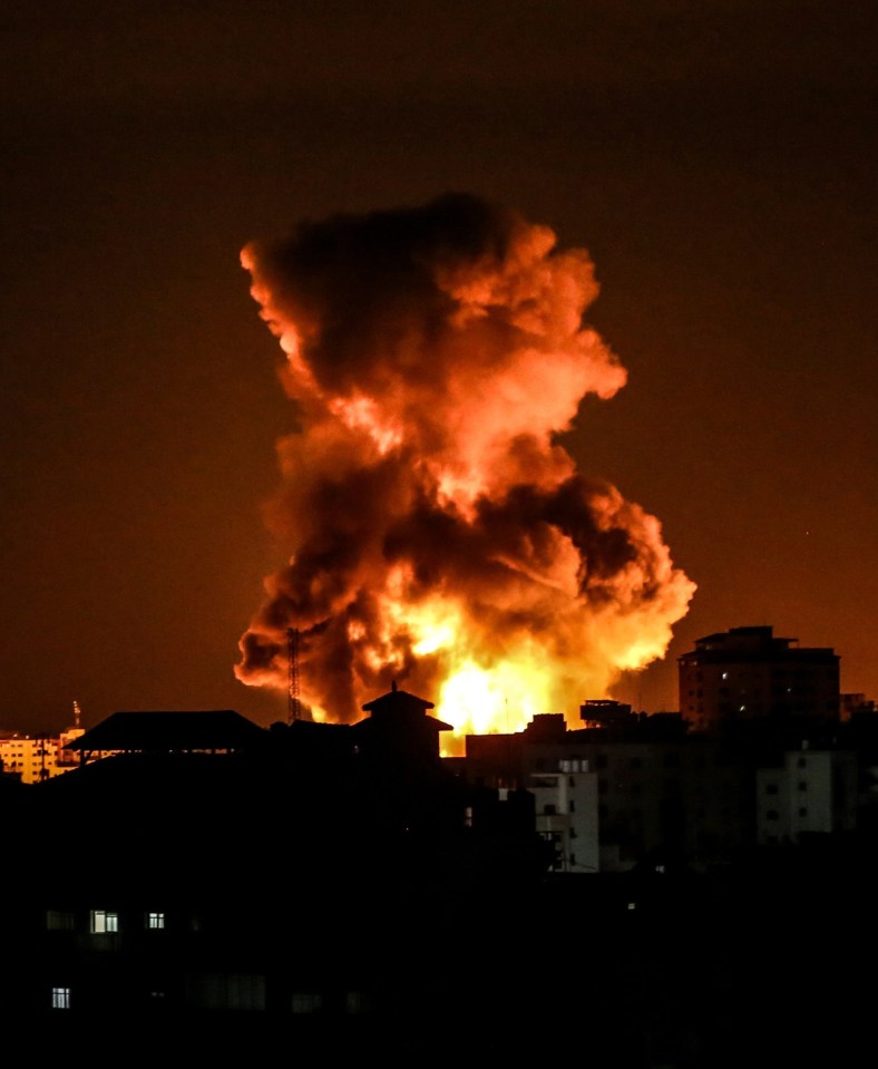 Fire and smoke rise above buildings in Gaza City as Israeli warplanes target the Palestinian enclave