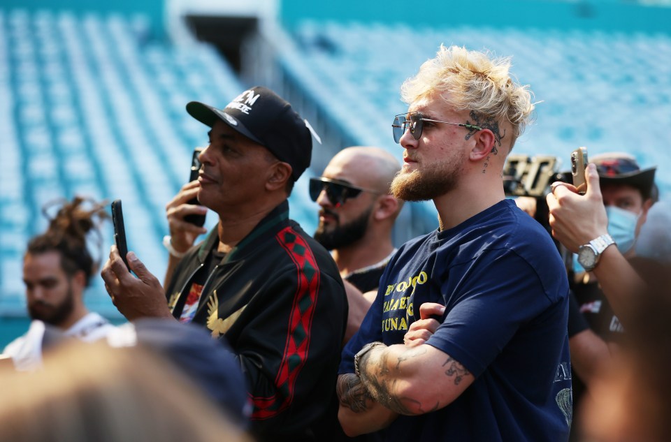 Jake Paul watches on in the press conference