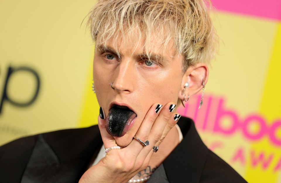 Machine Gun Kelly painted his tongue black for the occasion