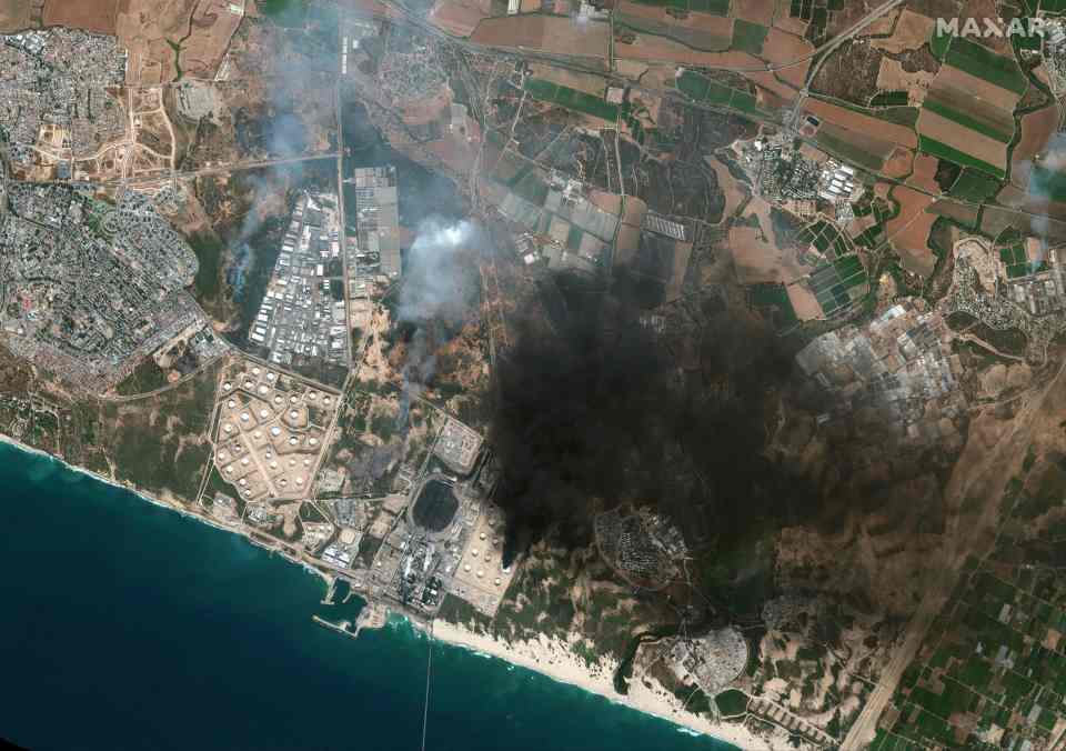 A satellite image shows smoke from a burning storage tank in Ashkelon, in southern Israel