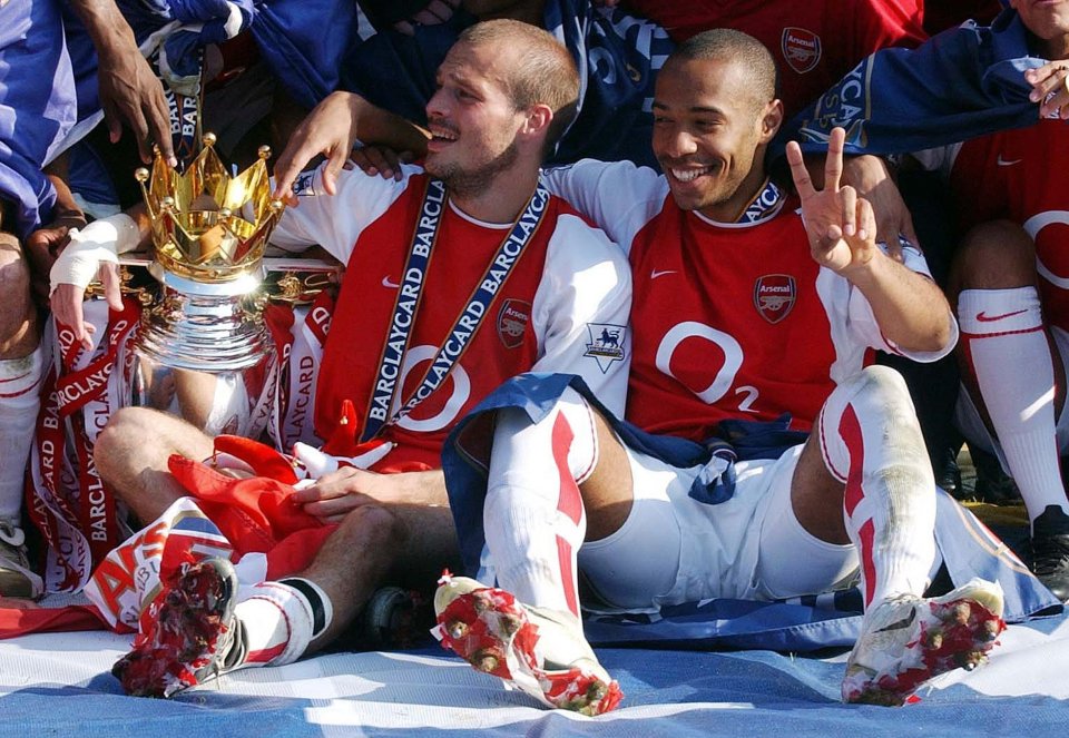 Thierry Henry (right) celebrates winning the 2003-04 Premier League with his Arsenal team-mates