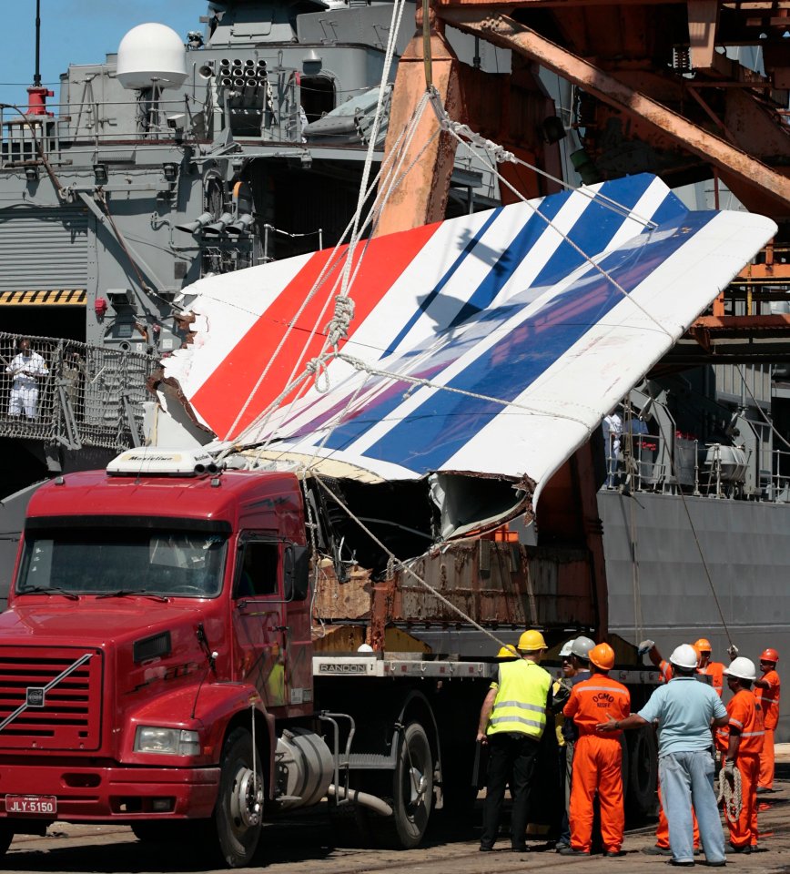 A large section of the jet is unloaded in the port of Recife, Brazil