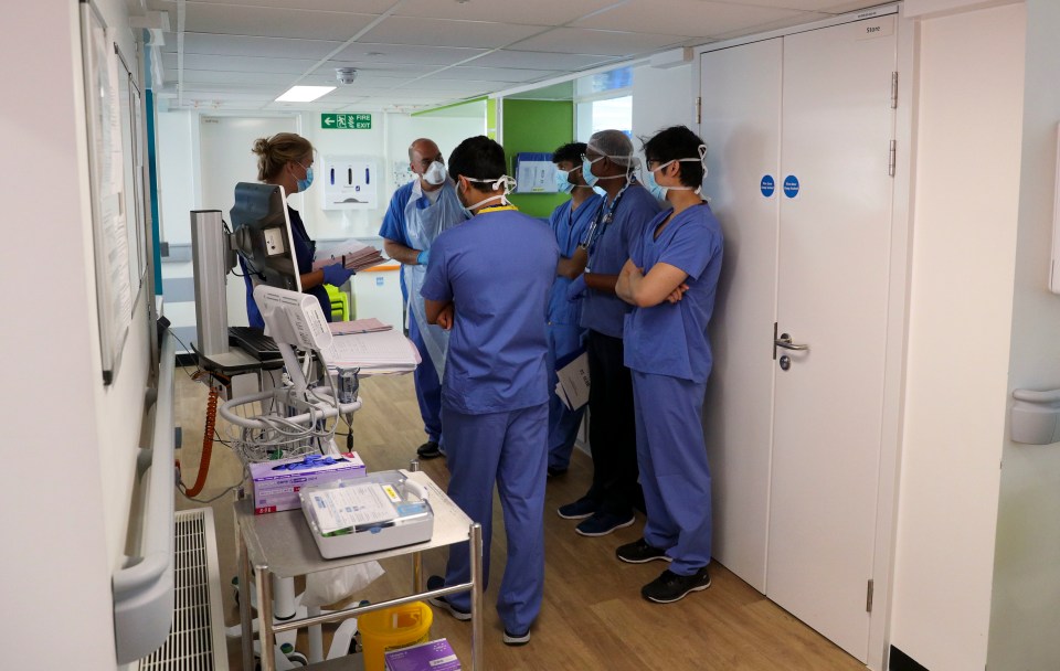 Staff gather for a briefing on a Covid-19 recovery ward at Wexham Park Hospital near Slough