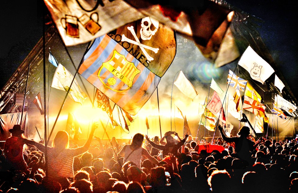 Flags and crowd in front of the Pyramid stage as Kanye West performs live during the second day of Glastonbury Festival at Worthy Farm in  2015