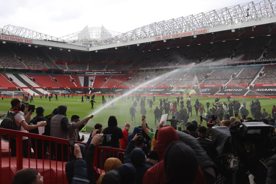 Supporters spilled onto the pitch during a protest outside Old Trafford