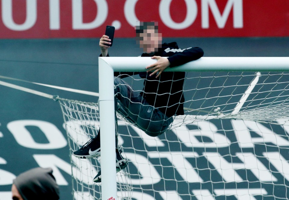 One lad climbed on to the goal at the Stretford End