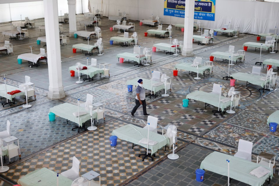 Beds are inside a Gurudwara converted into a coronavirus disease care facility in New Delhi