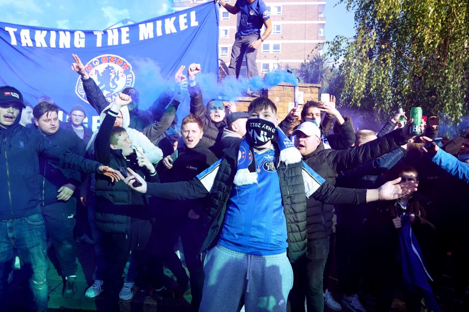 Chelsea fans lit flares as they welcomed their team to Stamford Bridge