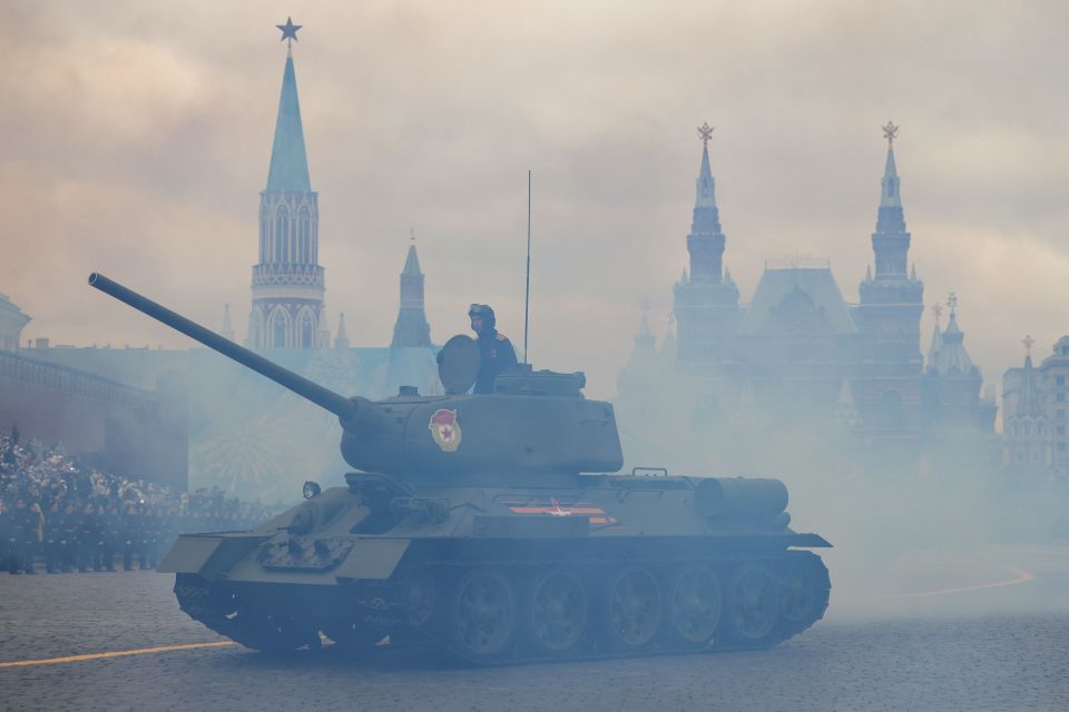 A T-34 tank moves through Red Square during the Victory Day military parade in Moscow