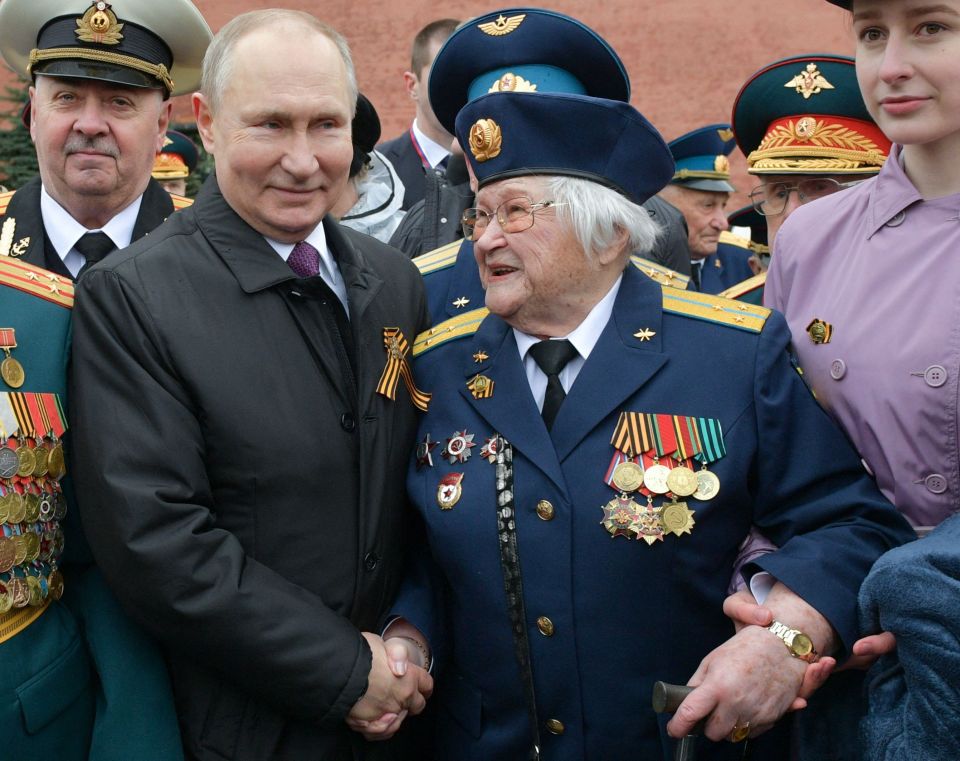 Vladimir Putin meets with veterans after the Victory Day military parade in Moscow