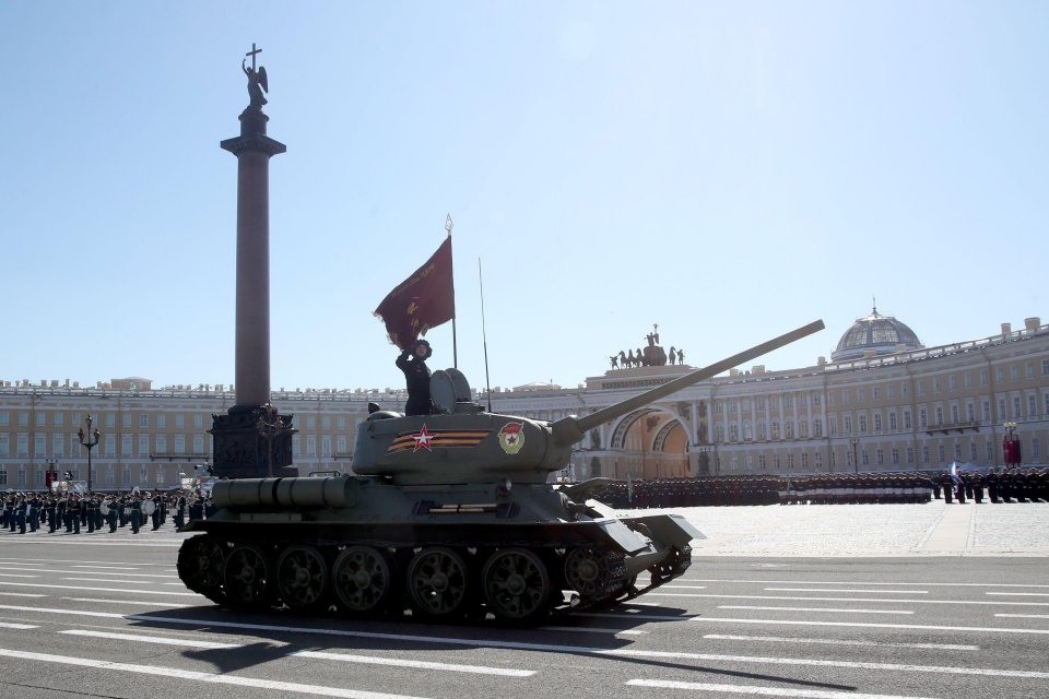 A T-34 tank rolls down Palace Square during the Victory Day military parade