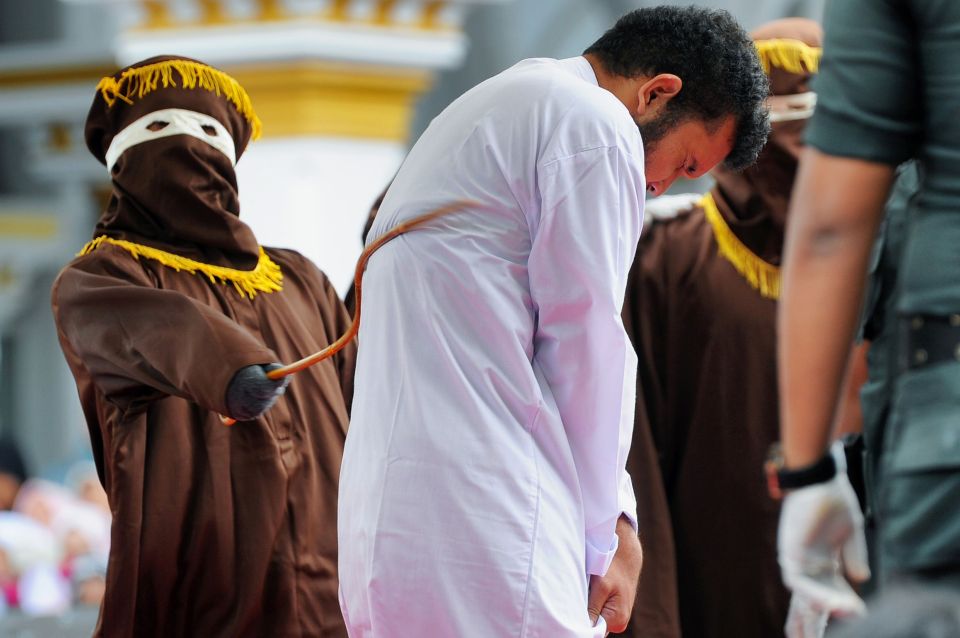 A man being caned for being gay in Banda Aceh in 2017 - the horrific practice still continues