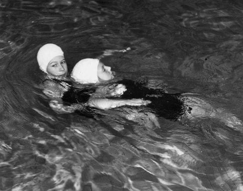 She also shared snaps of her as a teenager in gaining a lifesaving swimming badge