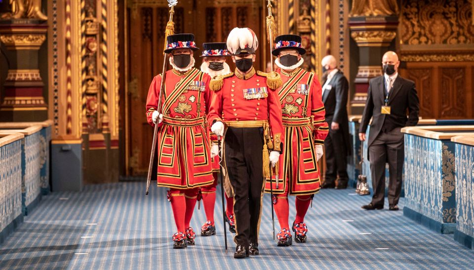 Masked Yeoman Warders march along the Royal gallery during the ceremonial search of the Palace of Westminster this morning