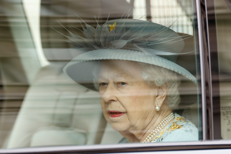 Dressed-down Queen Elizabeth on her way to the State Opening of Parliament in London