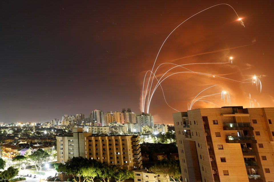  Streaks of light are seen as Israel's Iron Dome anti-missile system intercepts rockets launched from the Gaza Strip towards Israel, May 2021