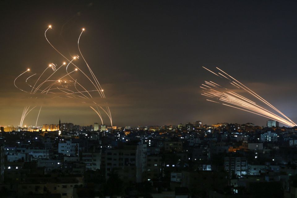 Missiles are seen in the night sky fired towards Israel from Beit Lahia in the northern Gaza Strip