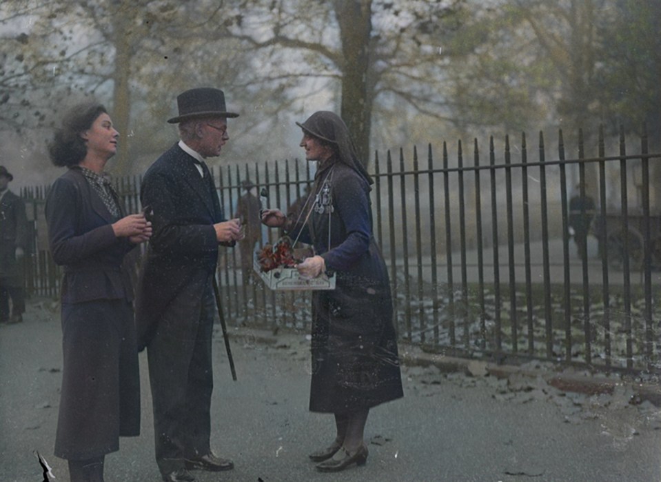 Prime Minister Ramsay MacDonald buys a poppy from a Red Cross nurse in St Jamess Park, 1932