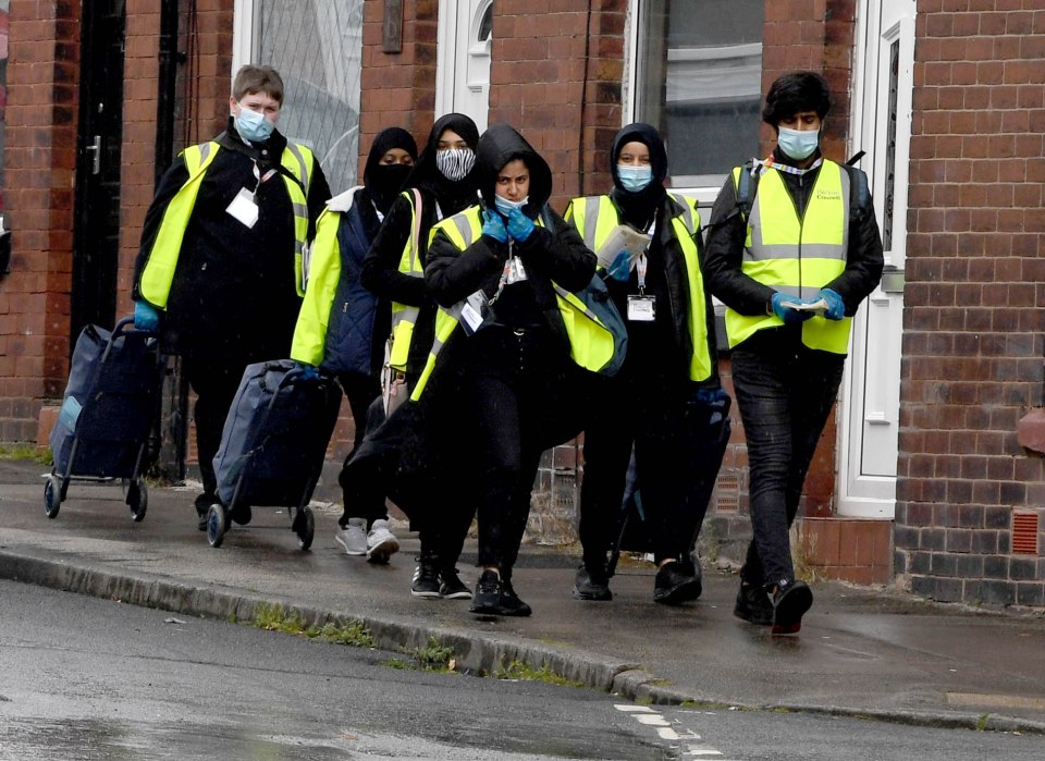 Teams go door-to-door handing out PCR test kits in Bolton