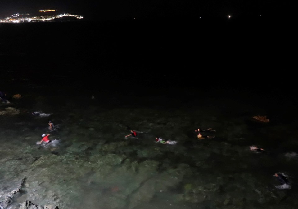 Moroccan migrants continued to swim past the border last night