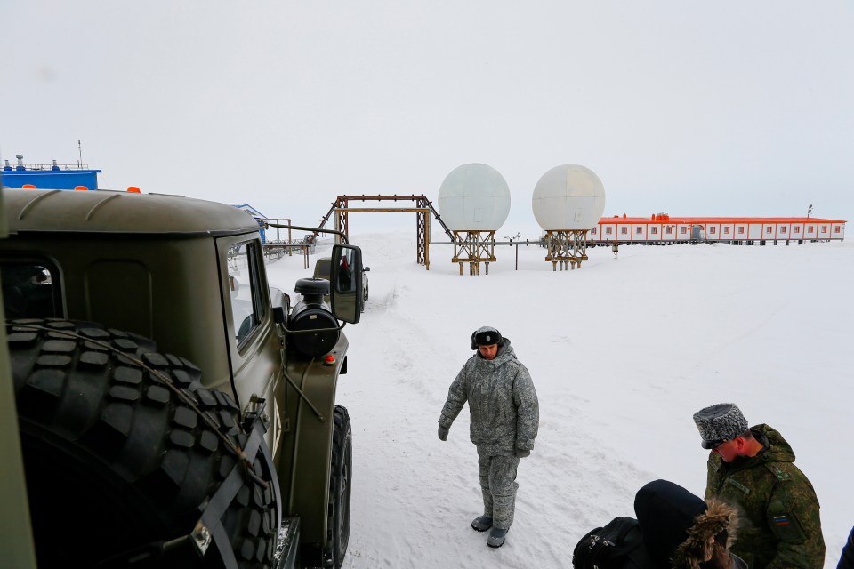 Soldiers stand at a radar facility on the Alexandra Land island near Nagurskoye