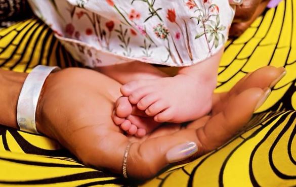 Naomi announced the news on her Instagram with a cute snap of her cradling her baby's feet